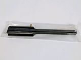 a close up of a pen on a white surface with a plastic bag