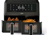 a close up of an air fryer with french fries in it