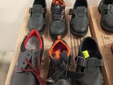 many pairs of shoes that are sitting on a box