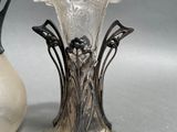 two vases sitting next to each other on a table