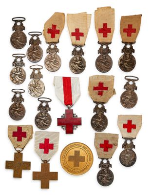 an assortment of medals and medals are displayed on a white surface
