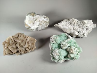 three different types of minerals are displayed on a white surface