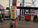 a picture of a car being worked on in a garage