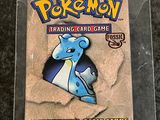 a close up of a pokemon trading card game in a plastic case