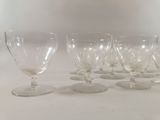 six wine glasses sitting on a table with a white background