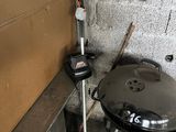 a black grill sitting in the corner of a room