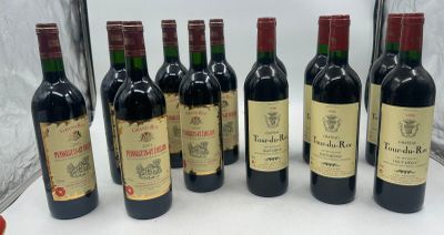 six bouteilles de vin rouge sont alignées sur une table