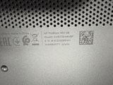 a close up of a metal plate with a qr code on it