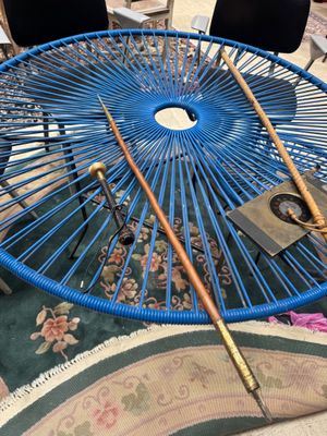 a blue table with a blue umbrella on top of it
