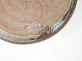 a close up of a bowl on a white surface