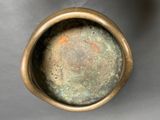 a close up of a metal bowl on a table