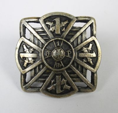 a close up of a metal buckle on a white surface