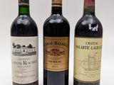 trois bouteilles de vin sont alignées sur une surface blanche