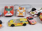 many toy cars that are lined up on a table