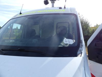 a white van with a sticker on the front of it