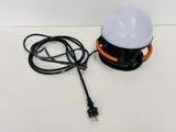 a close up of a lamp on a table with a cord