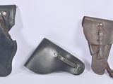 three different types of leather holsters are shown on a white background