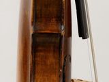 a violin that is sitting on top of a stand