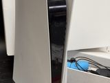 an image of a white computer on a black table