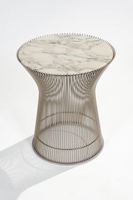 a white marble top side table with a metal wire base
