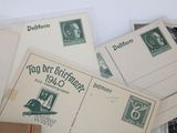 a pile of old postcards and envelopes on a table