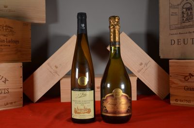 two bottles of wine sitting next to each other on a table