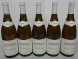 six bottles of wine are lined up on a table