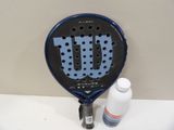 a close up of a tennis racket and a bottle of water