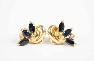 a pair of sapphire and diamond earrings