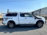 a picture of a white pick up truck parked in a parking lot