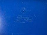 a close up of a blue container with a sticker on it