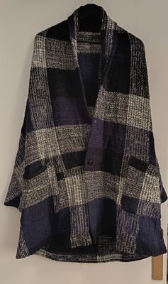 an image of a sweater hanging on a wall