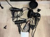 a bunch of hair dryers that are on the floor