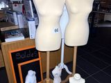 three mannequins on display in a store