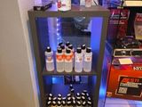 a display case filled with bottles of beer and other drinks