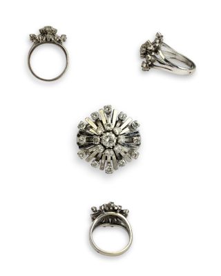 three silver rings and two silver rings with diamonds on them