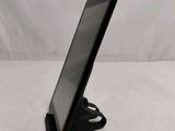 a close up of a tablet computer on a stand on a white surface