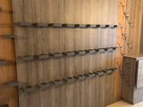 a picture of a kitchen with a counter and a wall mounted wine rack