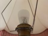 a lamp that is on a table in a room