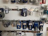 a wall full of kitchen utensils hanging on the wall