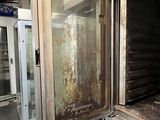 a dirty oven in the middle of a room