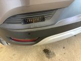a close up of a car ' s rear bumper with a sticker on it