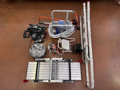 a lot of tools that are laying out on the floor