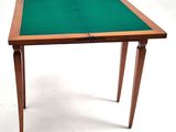 a close up of a table with a green cloth on it