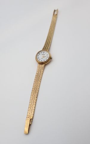 Montre de dame en or 18 carats 750 millièmes Claude Helier. En rè...