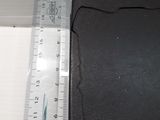 a ruler that is next to a black wallet