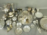 a lot of silver and silverware on a table