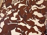 a picture of a brown and white painting on a table