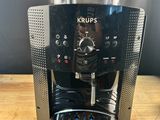 the coffee maker is sitting on the table ready to be used