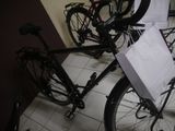 a bicycle with a bag on the back of it